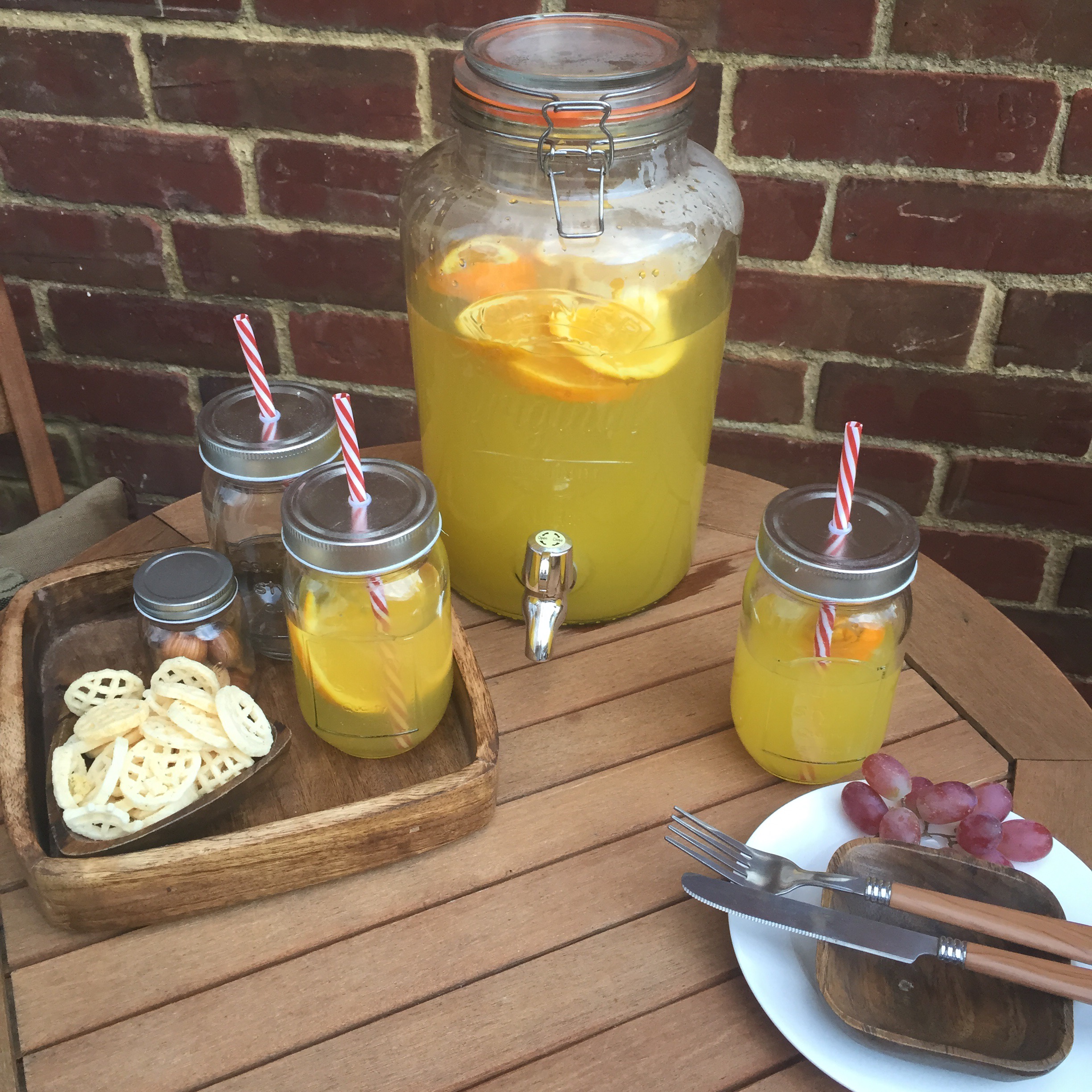 rustic outdoor dining with mason jar glasses via Always a Blue Sky Girl blog